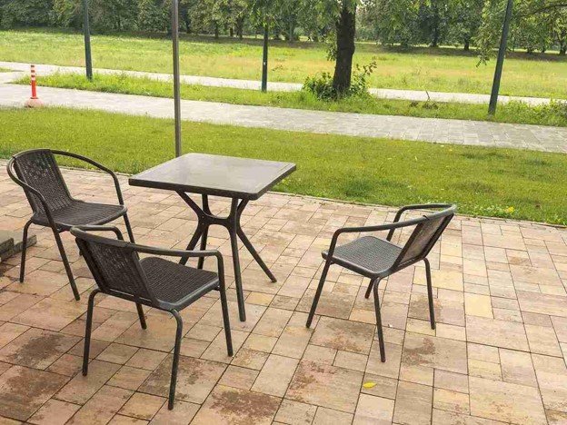 Completed concrete patio with outdoor seating area and clean paver layout in Chagrin Falls, OH