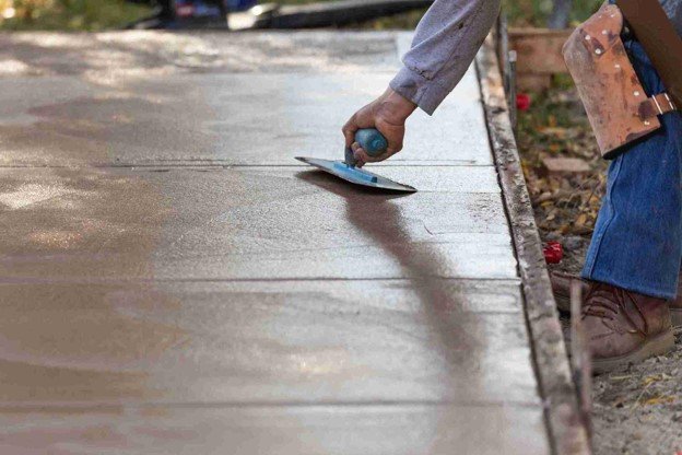 Newly installed concrete driveway with smooth finish and clean layout at residential home in Chagrin Falls, OH
